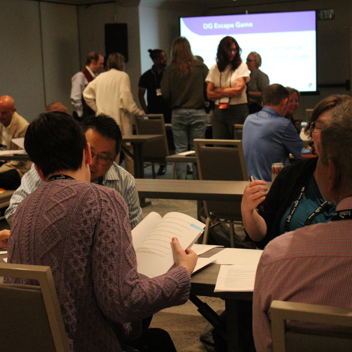 Attendees networking at a TDWI conference